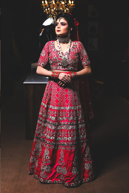 Radiant Red Bridal Lehenga Choli with Intricate Silver Embroidery